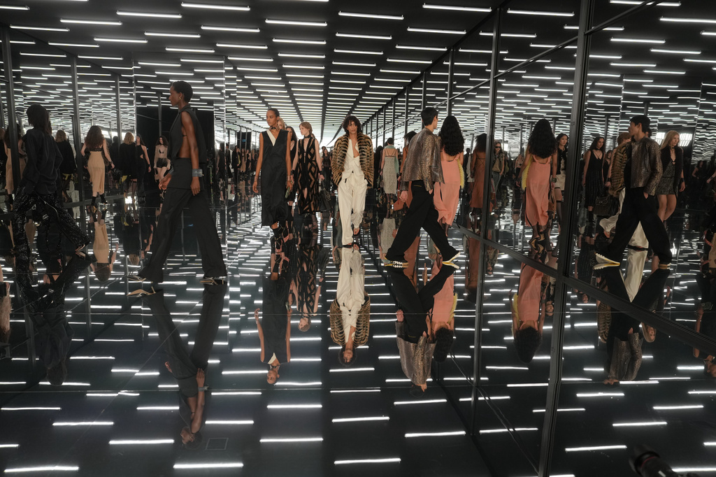 Models wear creations as part of the Fendi Spring/Summer 2027 Women's collection presented in Milan, Italy, Wednesday, Sept. 23, 2026. (AP Photo/Antonio Calanni)
