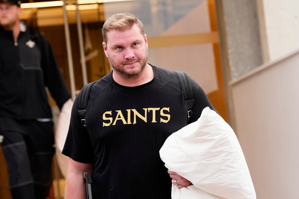 New Orleans Saints' David Edwards arrives at the reception pavilion of Charles de Gaulle airport in Roissy north of Paris, Monday, Oct. 19, 2026. (AP Photo/Teresa Suarez)