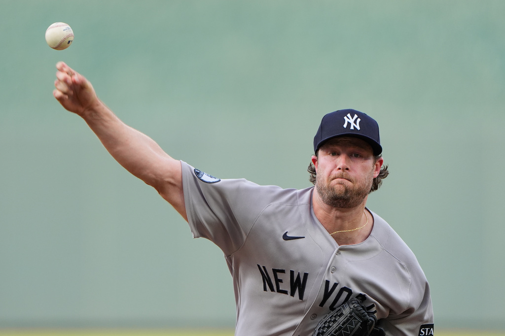 New York Yankees starting pitcher Gerrit Cole throws during the first inning of baseball game against the Kansas City Royals, Wednesday, May 27, 2026, in Kansas City, Mo. (AP Photo/Charlie Riedel)
