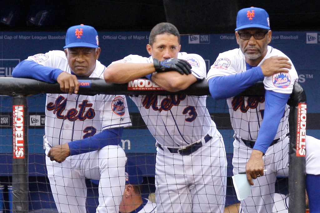 FILE - New York Mets' manager Jerry Manuel, right, watches the team bat with infielder Damion Easley, center, and coach Sandy Alomar Sr. in the seventh inning of their game against the Florida Marlins at Shea Stadium in New York, Sept. 28, 2008. (AP Photo/Julie Jacobson, File)