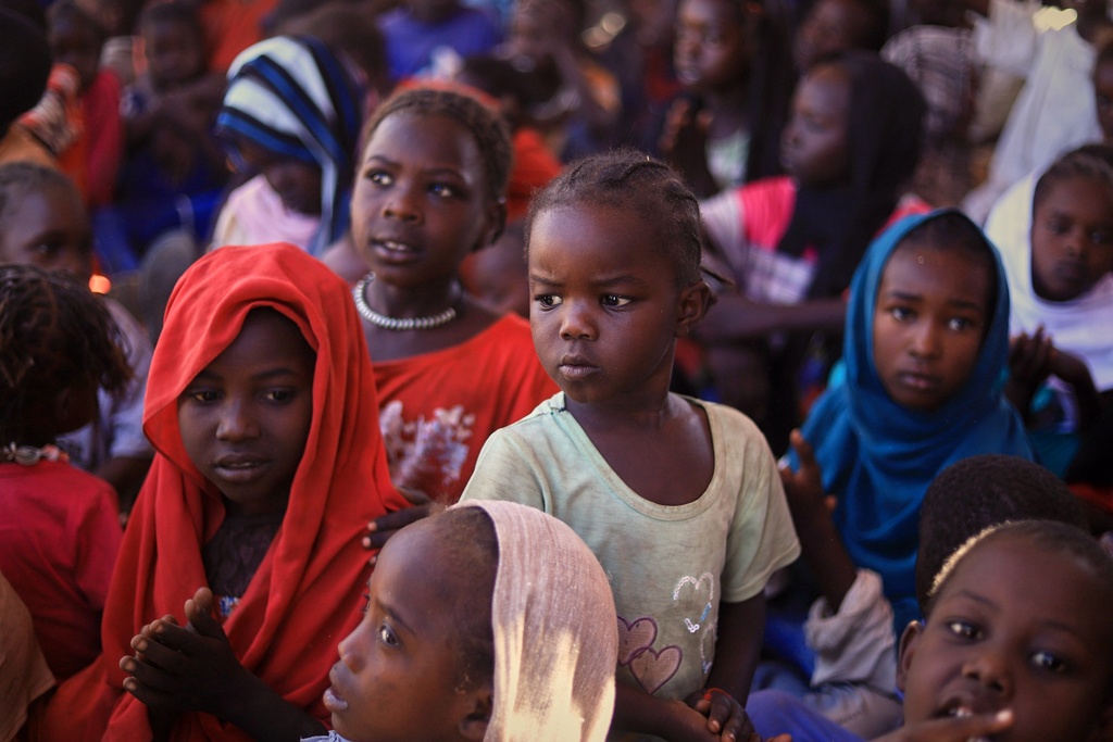 This photo released by The Norwegian Refugee Council (NRC), shows displaced children from el-Fasher at a camp where they sought refuge from fighting between government forces and the RSF, in Tawila, Darfur region, Sudan, Monday, Nov. 3, 2025. (NRC via AP)