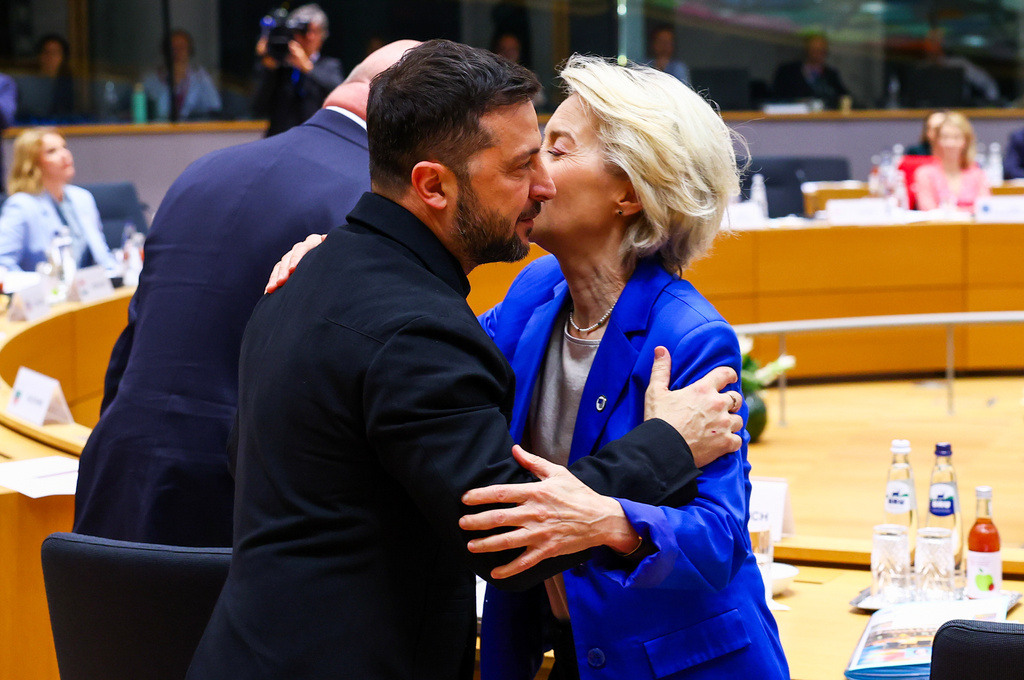 European Commission President Ursula von der Leyen, right, greets Ukraine's President Volodymyr Zelenskyy during a round table meeting at an EU Summit in Brussels, Thursday, Oct. 23, 2025. (Yves Herman, Pool Photo via AP)
