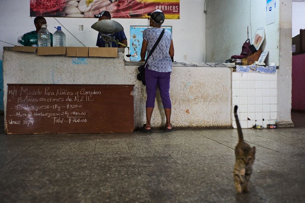 A woman stands at the counter of a state-run bodega in Havana, Cuba, Saturday, May 2, 2026. (AP Photo/Ramon Espinosa)