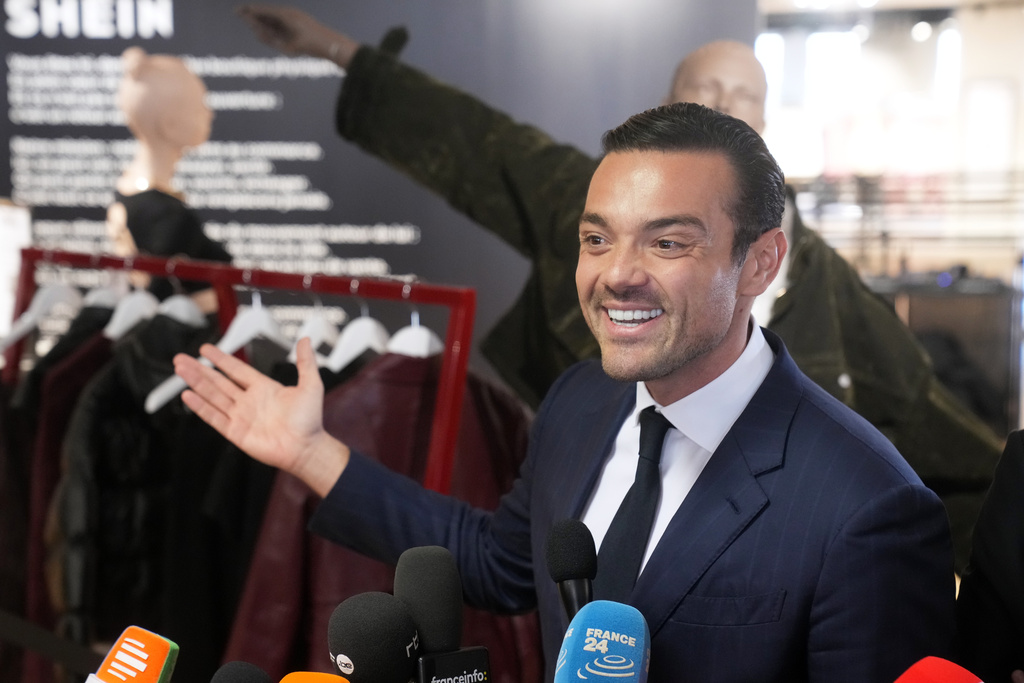 Frederic Merlin, CEO of SGM group which owns the BHV department store, answers reporters before fast fashion powerhouse Shein opens its first permanent store Wednesday, Nov. 5, 2025 in Paris. (AP Photo/Thibault Camus)