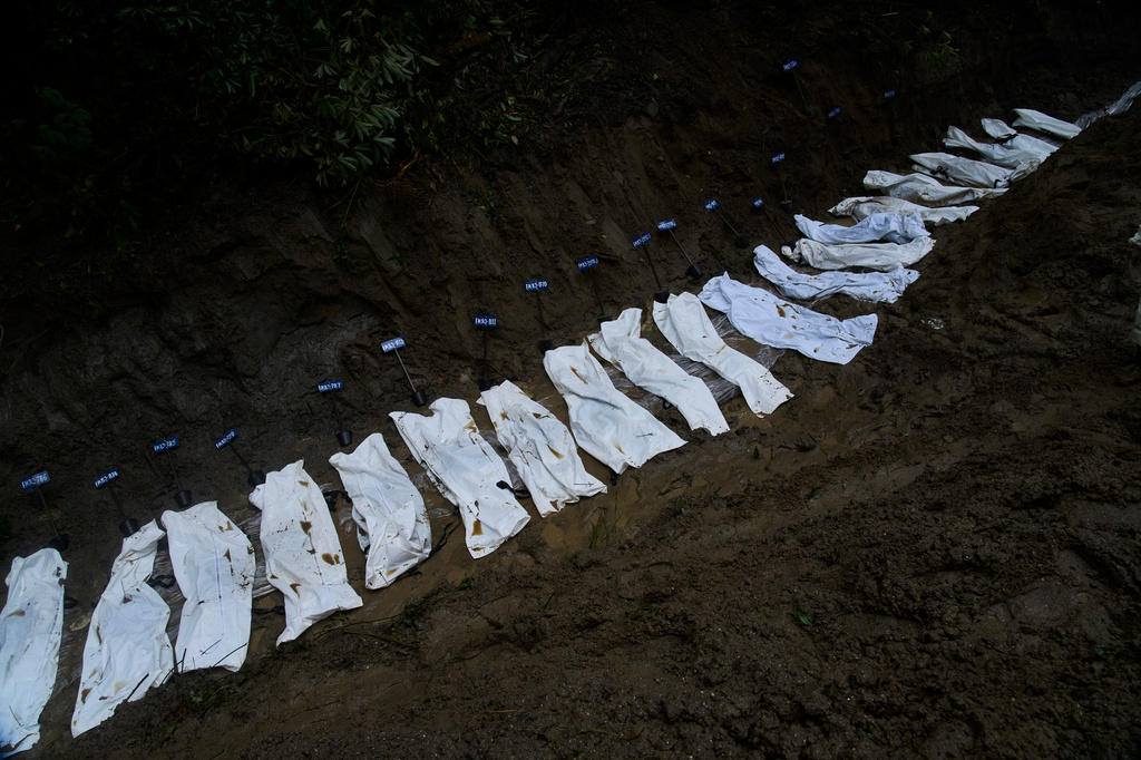 Row of bodies of flash flood victims are laid for mass burial in Kathmandu, Nepal, Tuesday, Sept. 1, 2026. (AP Photo/Niranjan Shrestha)