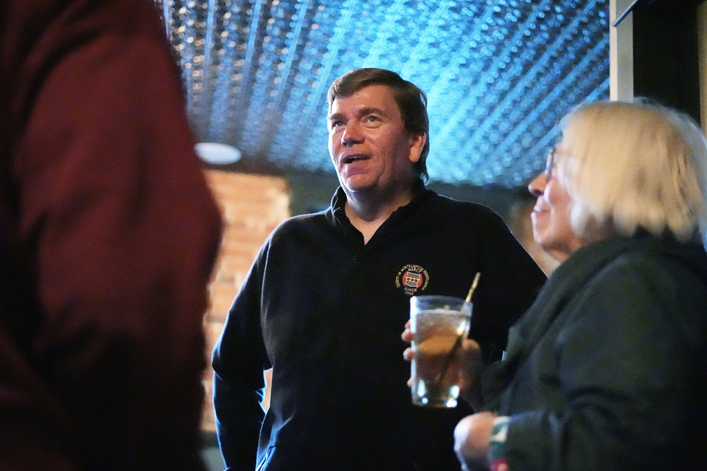 Lamont McClure, a candidate for the Democratic nomination in Pennsylvania's 7th Congressional District, speaks speaks with attendees at a social event in Bethlehem, Pa., Monday, May 11, 2026. (AP Photo/Matt Rourke)