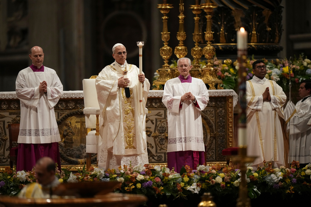 Pope Leo XIV leads the Easter Vigil inside St. Peter's Basilica at The Vatican, Saturday, April 4, 2026. (AP Photo/Andrew Medichini)