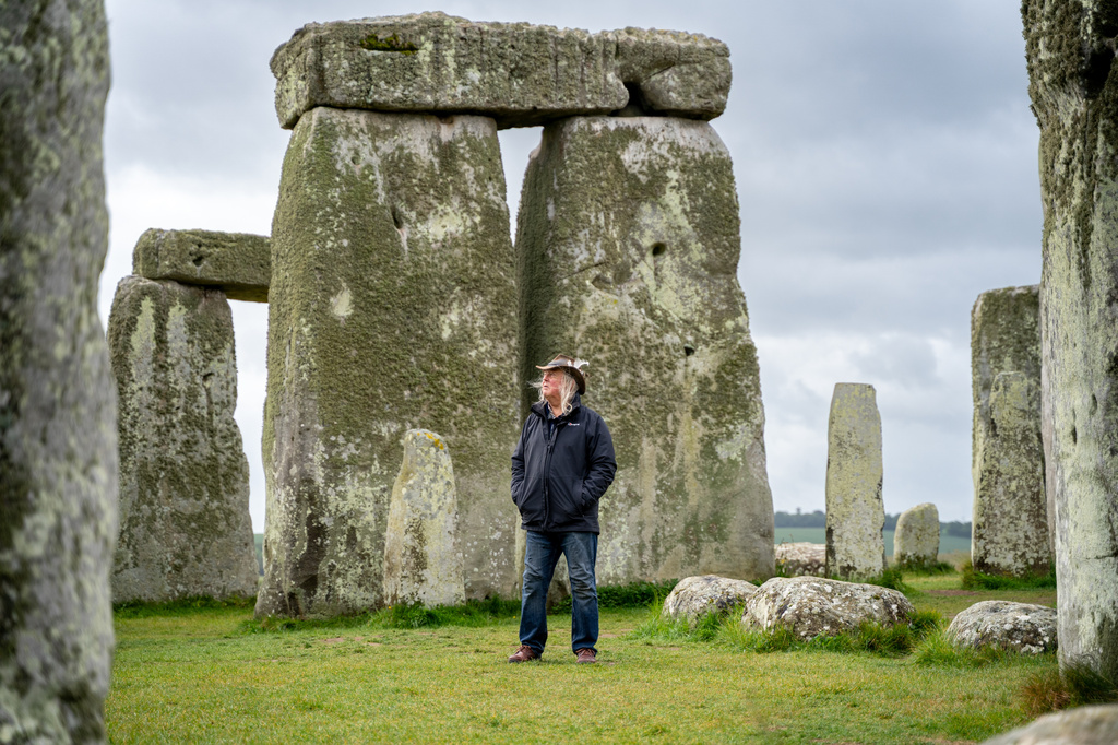 This photo provided by Wessex Archaeology shows archaeologist Phil Harding standing at Stonehenge in May 2026, near Salisbury, England. (Wessex Archaeology via AP)