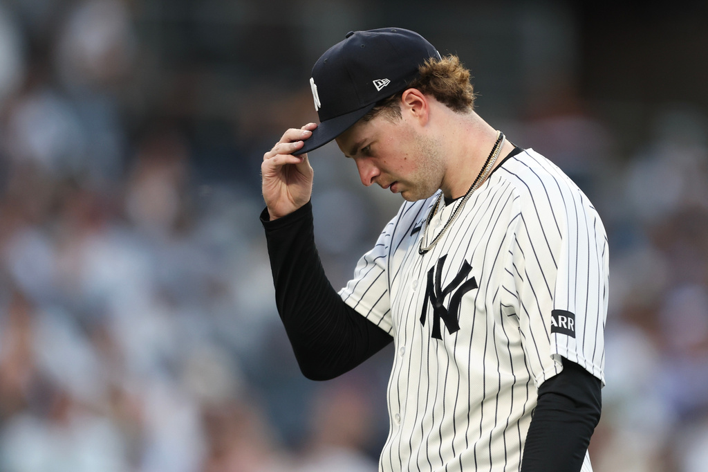 New York Yankees pitcher Cam Schlittler walks to the dugout during the third inning of a baseball game against the Detroit Tigers, Tuesday, June 30, 2026, in New York. (AP Photo/Heather Khalifa)