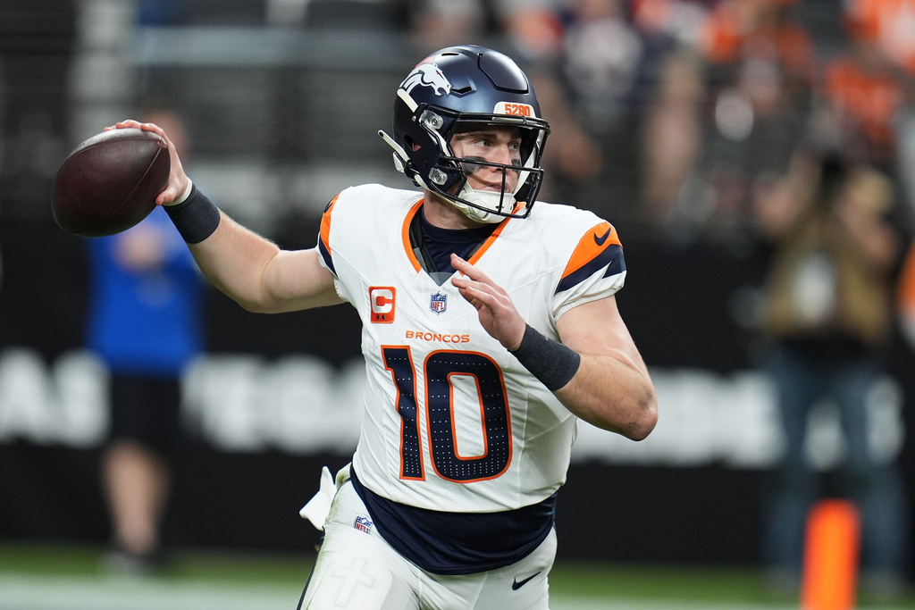 Denver Broncos quarterback Bo Nix (10) passes against the Las Vegas Raiders during the first half of an NFL football game in Las Vegas, Sunday, Dec. 7, 2025. (AP Photo/Gregory Bull)