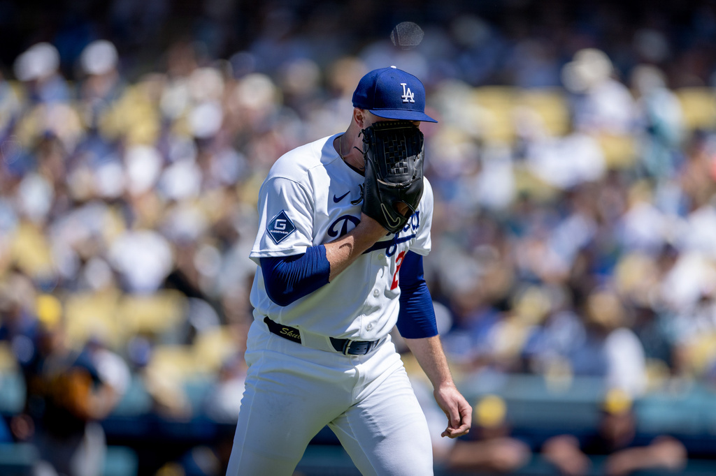 Los Angeles Dodgers pitcher Tarik Skubal yells into his glove while walking off the field during the fifth inning of a baseball game against the Milwaukee Brewers, Sunday, Aug. 16, 2026, in Los Angeles. (Eric Thayer/Los Angeles Times via AP)