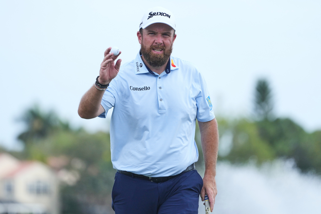 Shane Lowry of Ireland shows his ball on the 18th green during the third round of the Cognizant Classic golf tournament, Saturday, Feb. 28, 2026, in Palm Beach Gardens, Fla. (AP Photo/Marta Lavandier)