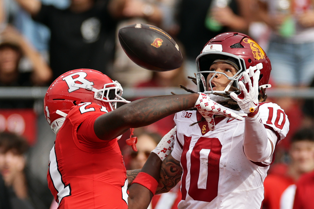 Rutgers defensive back Devonte Anderson (21) is called for pass interference on Southern California wide receiver Corey Simms (10) during the first half of an NCAA college football game Saturday, Sept. 19, 2026, in Piscataway, N.J. (AP Photo/Adam Hunger)