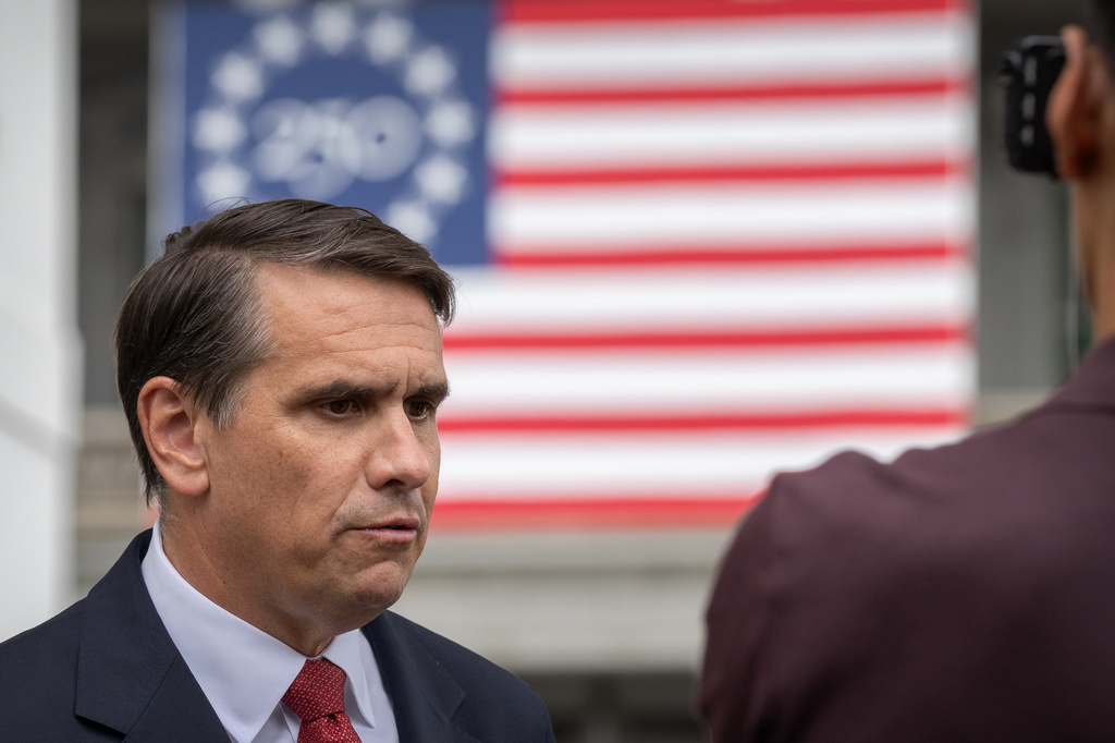 Acting Attorney General Todd Blanche speaks to a reporter outside the White House, Wednesday, May 27, 2026, in Washington. (AP Photo/Mark Schiefelbein)