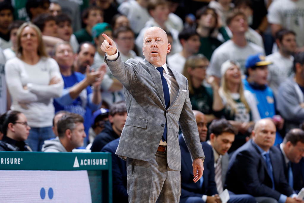 UCLA coach Mick Cronin directs his team during the first half of an NCAA college basketball game, Tuesday, Feb. 17, 2026, in East Lansing, Mich. (AP Photo/Al Goldis)