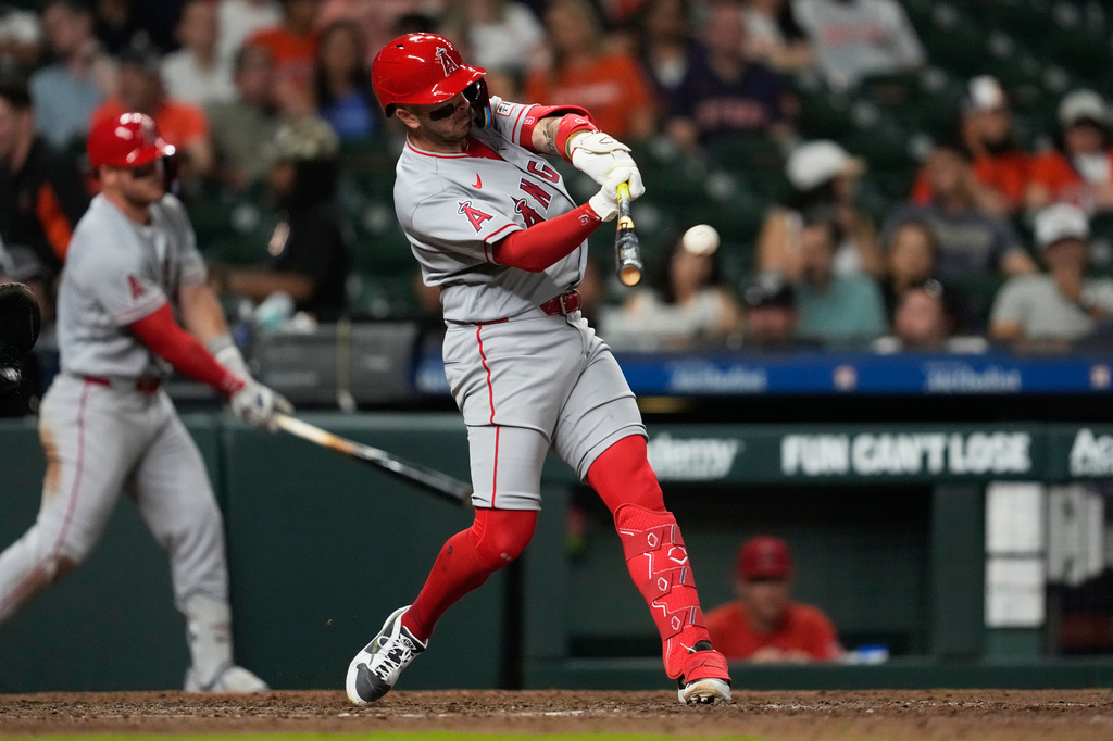 Los Angeles Angels' Zach Neto hits a home run during the ninth inning of a baseball game against the Houston Astros in Houston, Friday, March 27, 2026. (AP Photo/Ashley Landis)