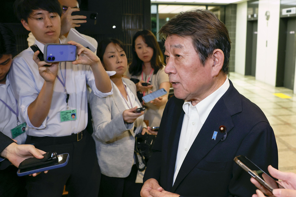 Japanese Foreign Minister Toshimitsu Motegi, right, speaks to reporters after he summoned Russian Ambassador to Japan Nikolay Nozdev, not pictured, in Tokyo Thursday, Aug. 13, 2026. (Kenzaburo Fukuhara/Kyodo News via AP)