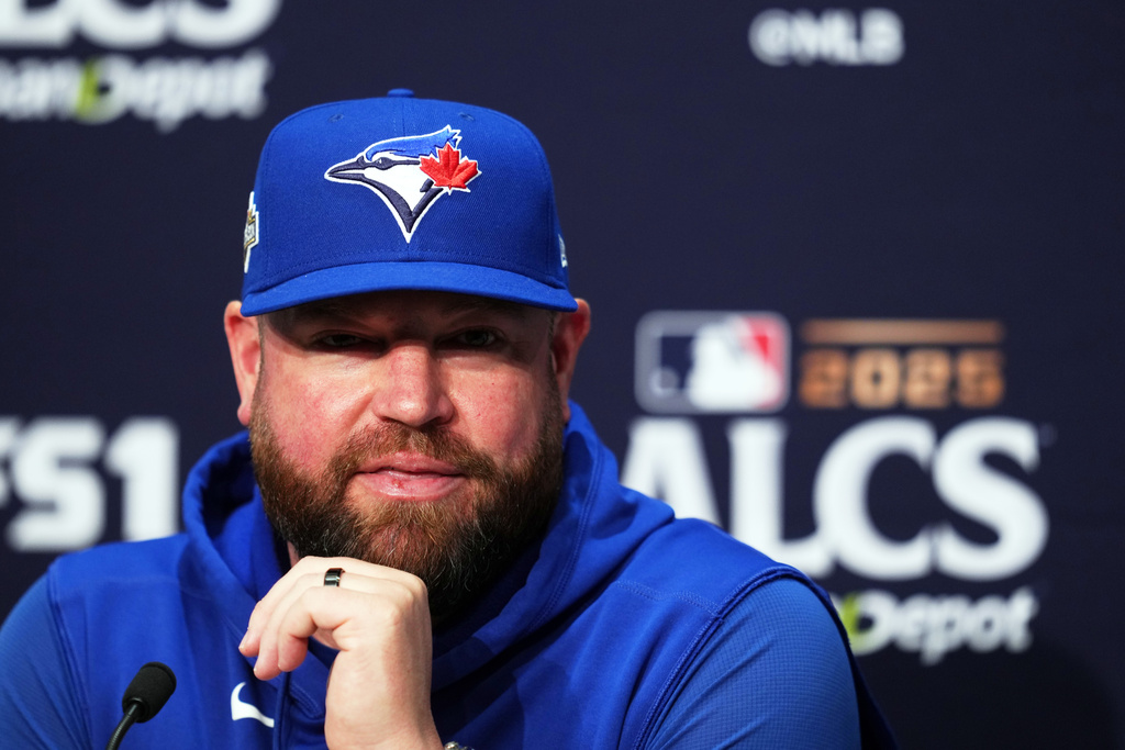 FILE - Toronto Blue Jays manager John Schneider speaks during a media availability the day before Game 3 of baseball's American League Championship Series against the Seattle Mariners, Oct. 14, 2025, in Seattle. (AP Photo/Lindsey Wasson, File)