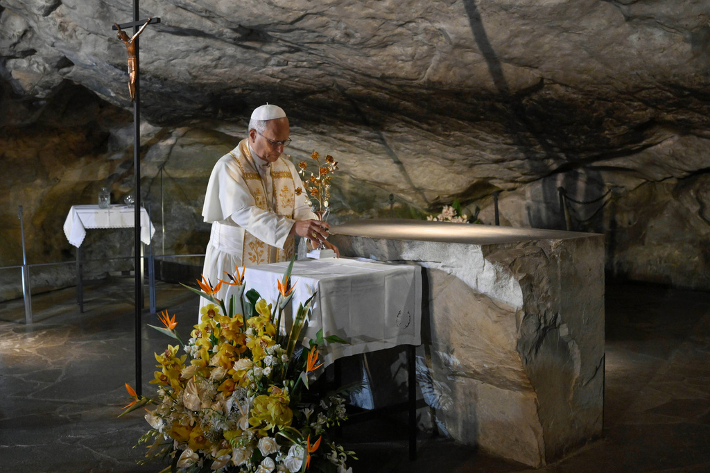 In this handout photo provided by Vatican Media Pope Leo XIV prays at the Grotto of the Apparitions of Massabielle, in Lourdes, France, Saturday, Sept. 26, 2026. (Vatican Media via AP)