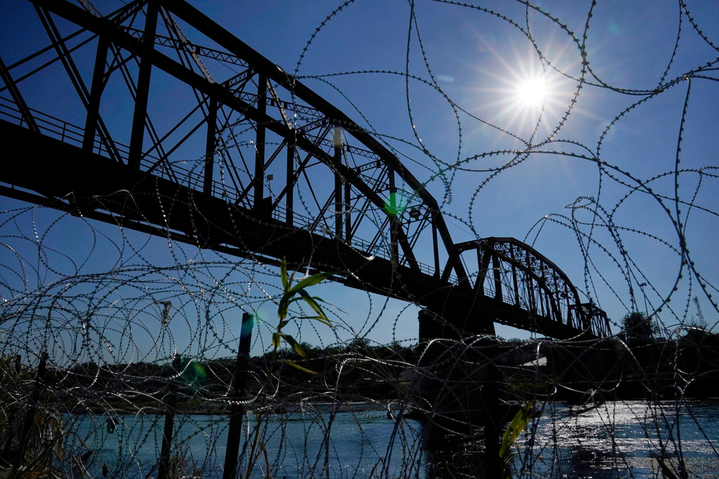 FILE - The Union Pacific International Railroad Bridge is seen behind concertina wire, Sept. 22, 2023, in Eagle Pass, Texas. (AP Photo/Eric Gay, File)
