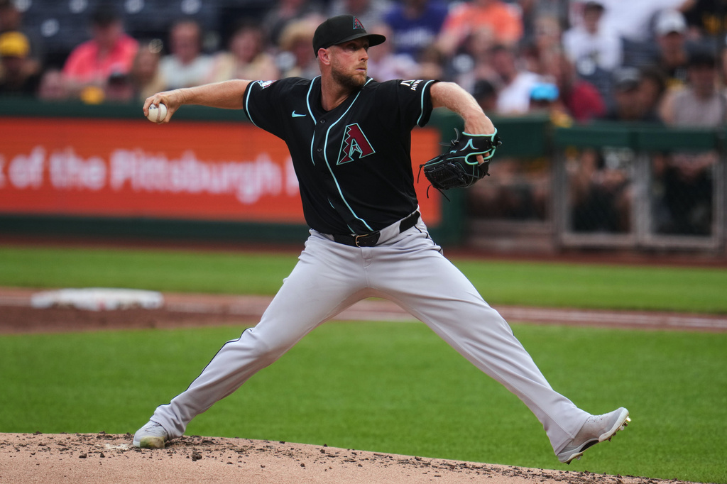 Arizona Diamondbacks pitcher Merrill Kelly delivers during the first inning of a baseball game against the Pittsburgh Pirates in Pittsburgh, Monday, July 27, 2026. (AP Photo/Gene J. Puskar)