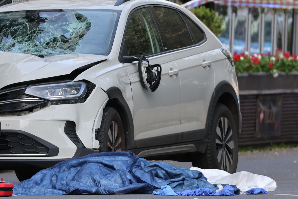 A damaged car that has crashed into several people is pictured in Leipzig, Germany, Monday, May 4, 2026. (Sebastian Willnow/dpa via AP)