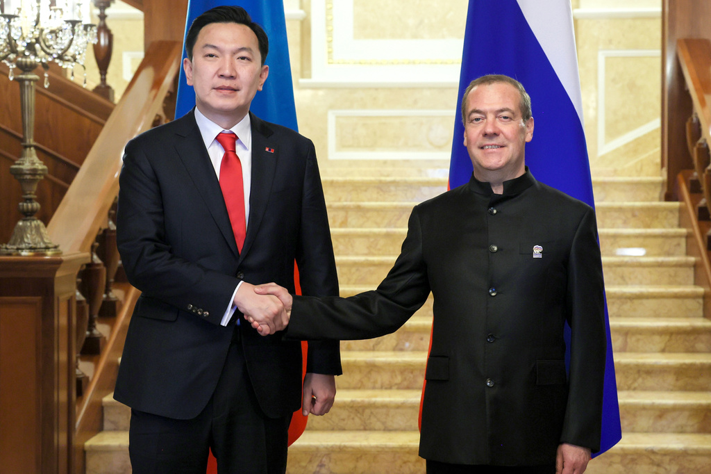 FILE - Russian Security Council Deputy Chairman and the head of the United Russia party Dmitry Medvedev, right, and Chairman of Mongolian People's Party and Chairman of the State Great Khural Nyam-Osoryn Uchral pose for a photo during their meeting at the Gorki state residence outside Moscow, on Feb. 10, 2026. (Ekaterina Shtukina, Sputnik Pool Photo via AP, File)