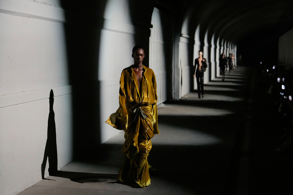 A model wears a creation part of The Attico women's Spring-Summer 2027 collection, presented in Milan, Italy, Friday, Sept. 25, 2026. (AP Photo/Luca Bruno)