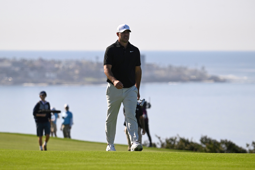 Brooks Koepka walks the fourth fairway on the South Course at Torrey Pines during the first round of the Farmers Insurance Open golf tournament Thursday, Jan. 29, 2026, in San Diego. (AP Photo/Denis Poroy)