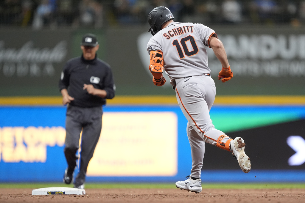 San Francisco Giants' Casey Schmitt (10) rounds the bases after hitting a three-run home run during the seventh inning of a baseball game against the Milwaukee Brewers, Saturday, Aug. 23, 2025, in Milwaukee. (AP Photo/Aaron Gash)