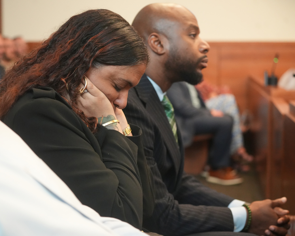 The mother of Casey Goodson Jr., Tamala Payne, covers her ears during opening statements in the retrial offormer Franklin County Deputy Jason Meade, who is charged with murder and reckless homicide in the 2020 killing of Goodson Jr., inside Franklin County Common Pleas Court in Columbus, Ohio, Thursday, April 23, 2026. (Doral Chenoweth/Pool Photo via AP)