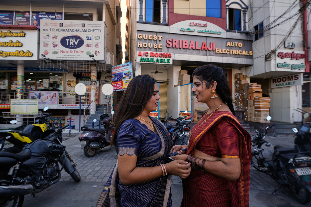 Transgender Ananya, left, and Nazariya Kutty talk before leaving for the Koothandavar temple to perform rituals during the Koovagam festival in Villupuram, in the southern Indian state of Tamil Nadu, Tuesday, April 28, 2026. (AP Photo/Mahesh Kumar A.)