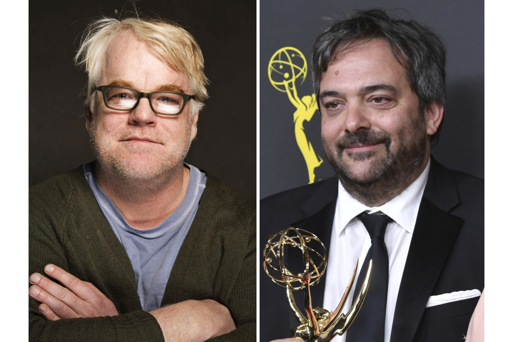 Philip Seymour Hoffman poses for a portrait during the Sundance Film Festival in Park City, Utah on Jan. 19, 2014, left, and Adam Schlesinger appears at the Creative Arts Emmy Awards in Los Angeles on Sept. 14, 2019. (AP Photo)