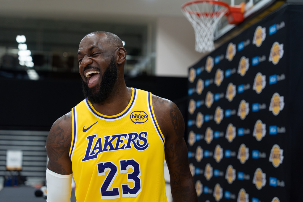 Los Angeles Lakers' LeBron James shares a laugh with a reporter during the NBA basketball team's media day in El Segundo, Calif., Monday, Sept. 29, 2025. (AP Photo/Jae C. Hong)