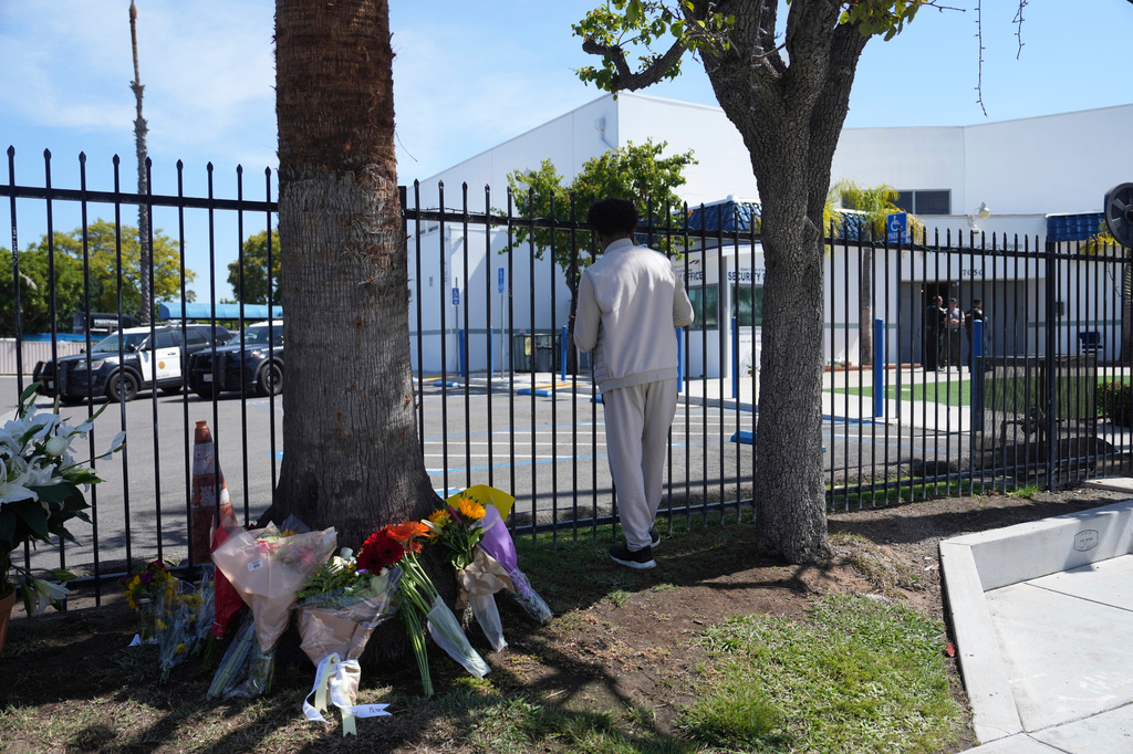 A man who did not want to be identified stands outside of the Islamic Center of San Diego, the day after a shooting, Tuesday, May 19, 2026, in San Diego. (AP Photo/Jae C. Hong)