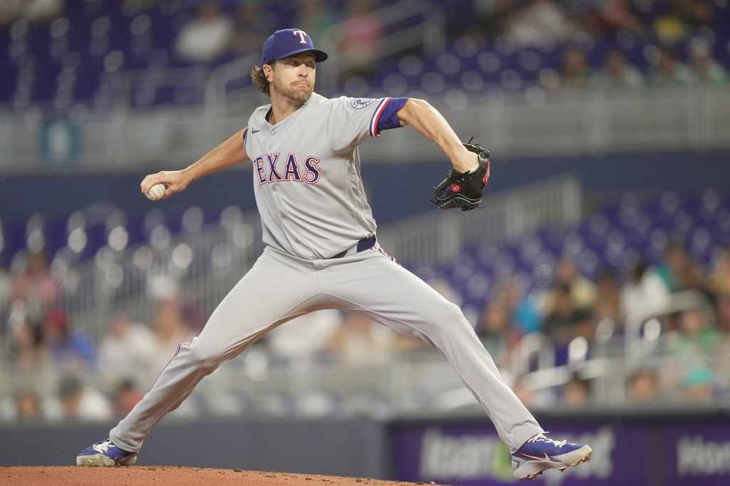 Texas Rangers starting pitcher Jacob Degrom (48) throws against the Miami Marlins in the first inning of a baseball game, Wednesday, June 24, 2026, in Miami. (AP Photo/Jim Rassol)