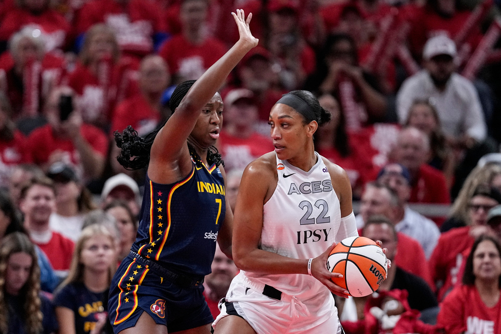 Indiana Fever center Aliyah Boston (7) defends Las Vegas Aces center A'ja Wilson (22) during the first half in Game 2 of a WNBA basketball first-round playoff series in Indianapolis, Tuesday, Sept. 29, 2026. (AP Photo/Michael Conroy)