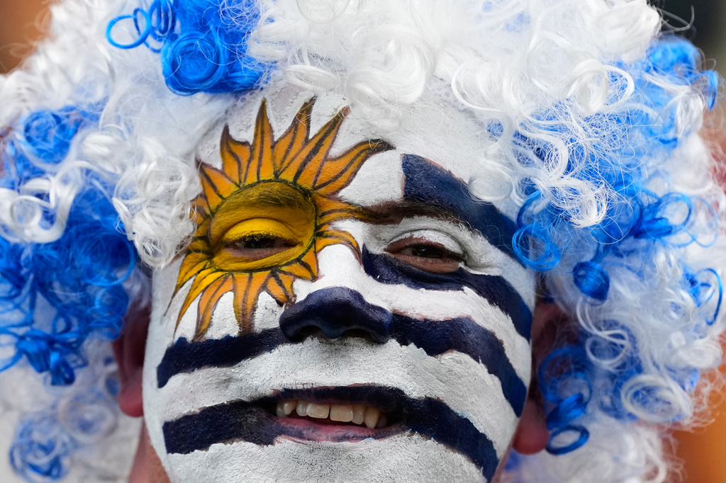 A fan of Uruguay smiles prior to the World Cup Group H soccer match between Saudi Arabia and Uruguay in Miami Gardens, Fla., Monday, June 15, 2026. (AP Photo/Rebecca Blackwell)