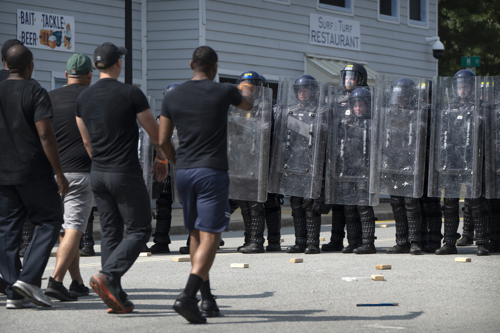 During a training exercise involving local and federal law enforcement organized by the U.S. Capitol Police, people confront police officers wearing protective equipment at the U.S. Secret Service James J. Rowley Training Center Friday, Sept. 5, 2025, in Laurel, Md. (AP Photo/Mark Schiefelbein)
