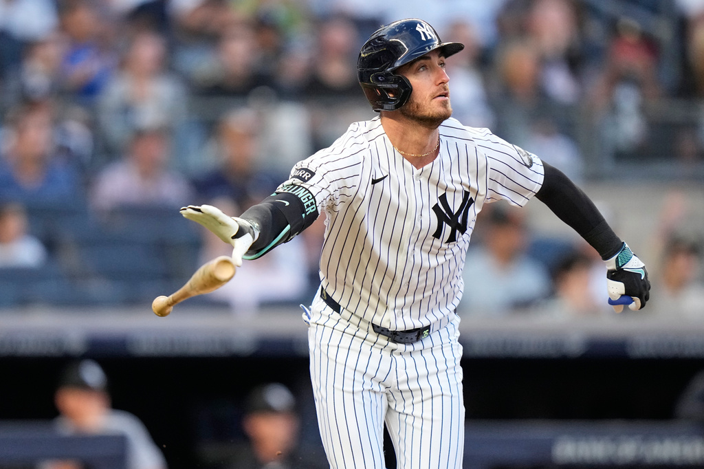 New York Yankees' Cody Bellinger (35) tosses his bat as he watches the ball he hit for a two-run home run during the first inning of a baseball game against the Chicago White Sox Wednesday, June 17, 2026, in New York. (AP Photo/Frank Franklin II)
