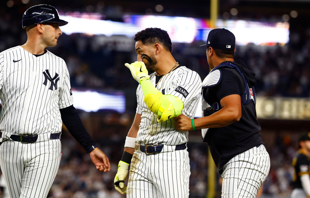 New York Yankees' José Caballero looks at Pittsburgh Pirates pitcher Dennis Santana after a scuffle during the ninth inning of a baseball game, Monday, July 20, 2026 in New York. (AP Photo/Noah K. Murray)