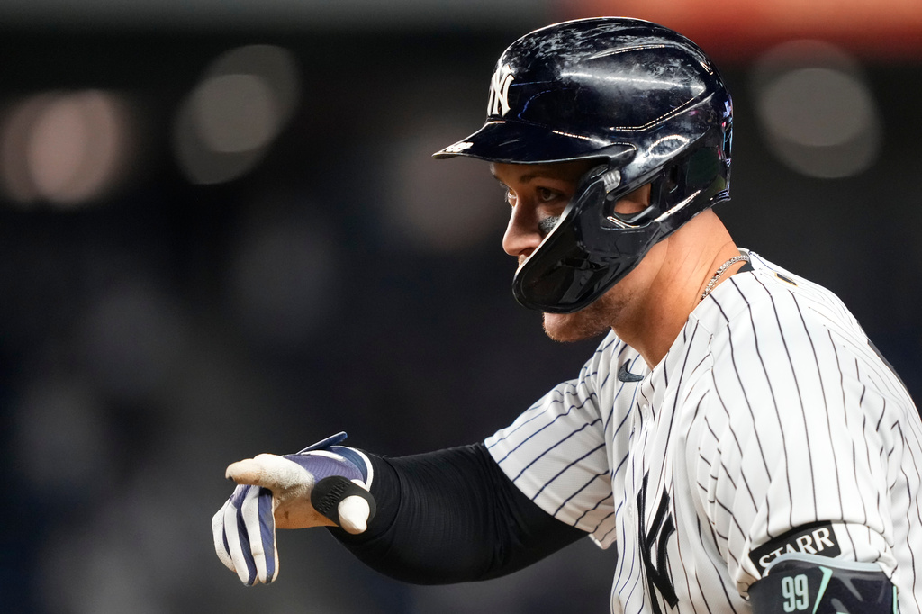 New York Yankees' Aaron Judge (99) reacts after hitting an RBI single during the eighth inning of a baseball game against the Baltimore Orioles, Monday, May 4, 2026, in New York. (AP Photo/Yuki Iwamura)