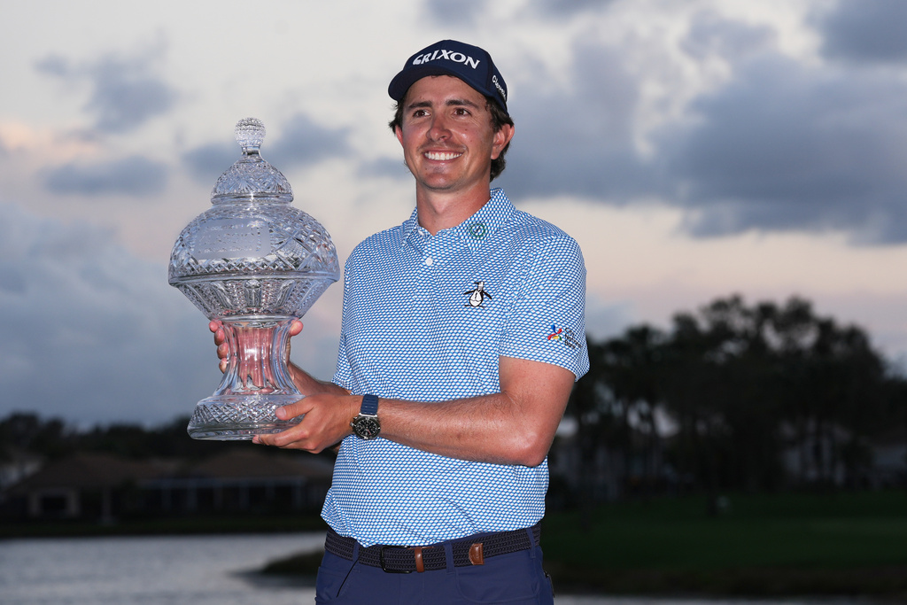 Nico Echavarria of Colombia holds the Cognizant Classic Trophy at the end of the final round of the Cognizant Classic golf tournament, Sunday, March 1, 2026, in Palm Beach Gardens, Fla. (AP Photo/Marta Lavandier)
