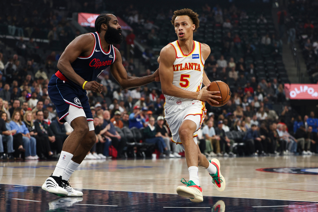 Atlanta Hawks guard Dyson Daniels (5) drives against Los Angeles Clippers guard James Harden, left, during the first half of an NBA basketball game, Monday, Nov. 10, 2025, in Inglewood, Calif. (AP Photo/Jessie Alcheh)