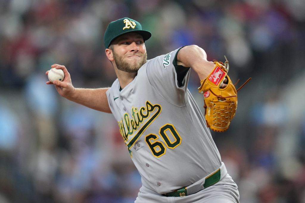 Athletics pitcher Justin Sterner throws to the Texas Rangers during the sixth inning of a baseball game Sunday, April 26, 2026, in Arlington, Texas. (AP Photo/Julio Cortez)