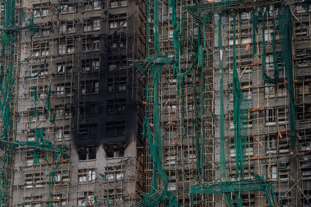 Burned buildings are seen at the scene of the fire that started Wednesday at Wang Fuk Court, a residential estate in the Tai Po district of Hong Kong's New Territories, Friday, Nov. 28, 2025. (AP Photo/Chan Long Hei)
