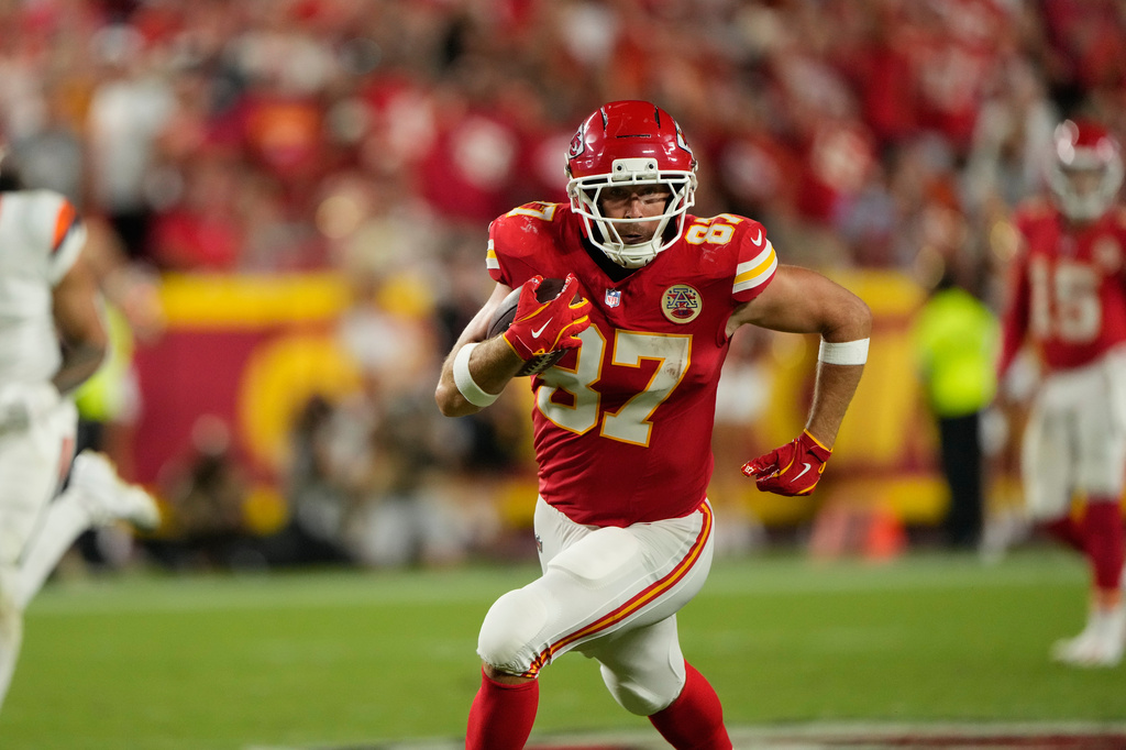 Kansas City Chiefs tight end Travis Kelce runs the ball after making a catch against the Denver Broncos during the second half of an NFL football game Monday, Sept. 14, 2026, in Kansas City, Mo. (AP Photo/Charlie Riedel)