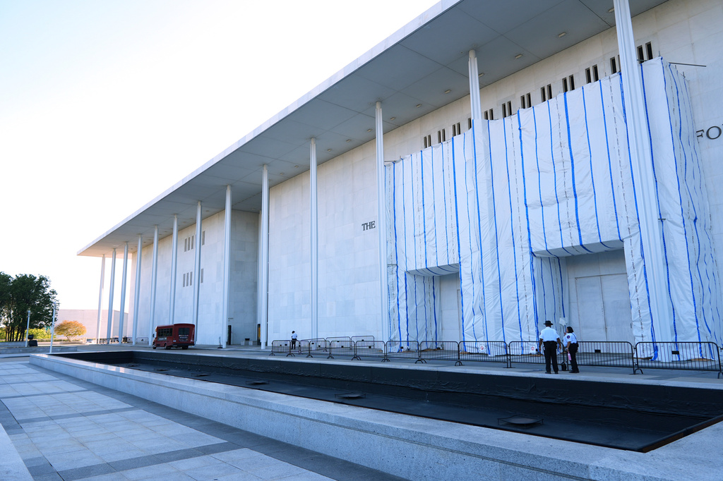 Security officials stand outside of the John F. Kennedy Center for the Performing Arts in Washington, Tuesday, Sept. 15, 2026. (AP Photo/Jacquelyn Martin)