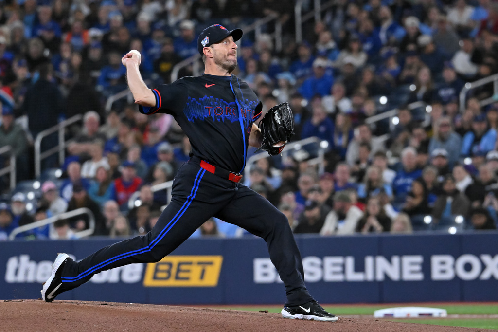 Toronto Blue Jays pitcher Max Scherzer throws to a Cleveland Guardians batter in first-inning baseball game action in Toronto, Friday, April 24, 2026. (Jon Blacker/The Canadian Press via AP)