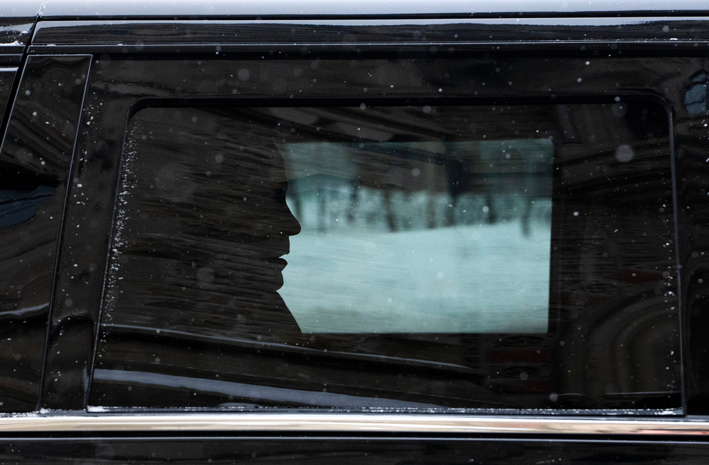 Canadian Prime Minister Mark Carney arrives by motorcade to Parliament Hill in Ottawa, Tuesday, Jan. 27, 2026. (Adrian Wyld/The Canadian Press via AP)